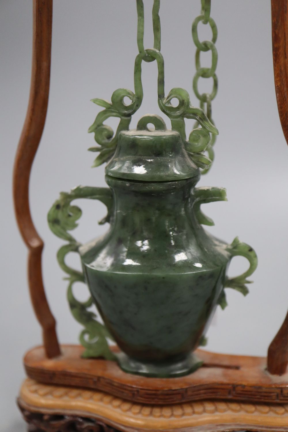 A jade vase on stand